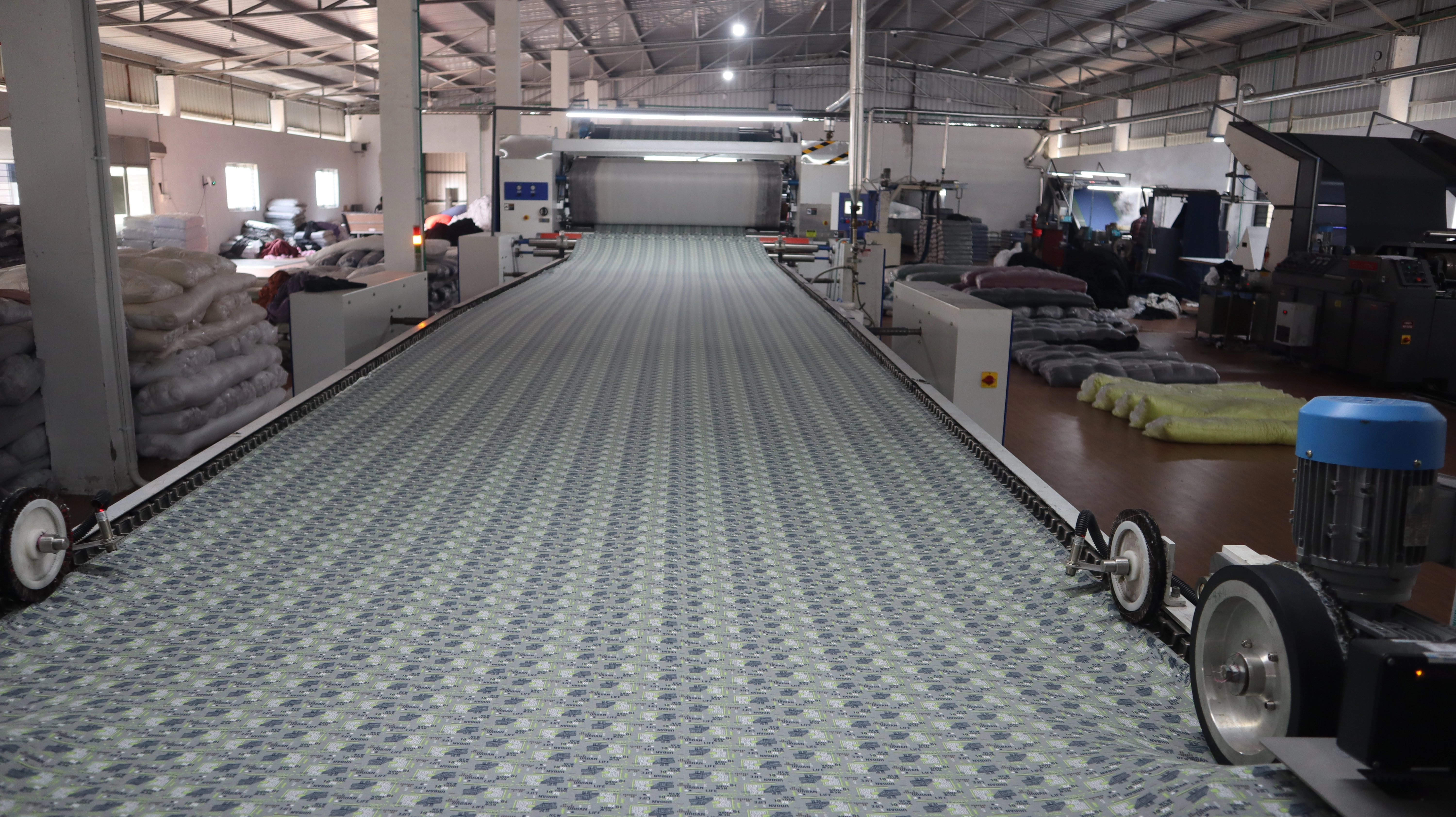 A modern factory floor representing our textile machinery business